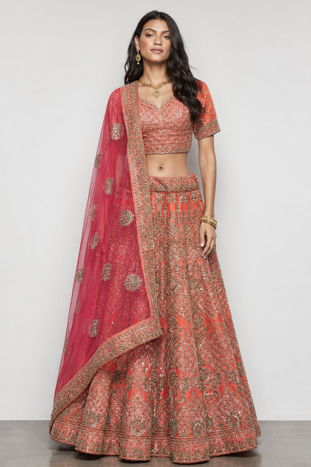 Orange Raw Silk Bridal Lehenga with Kardana Kashab Moti work