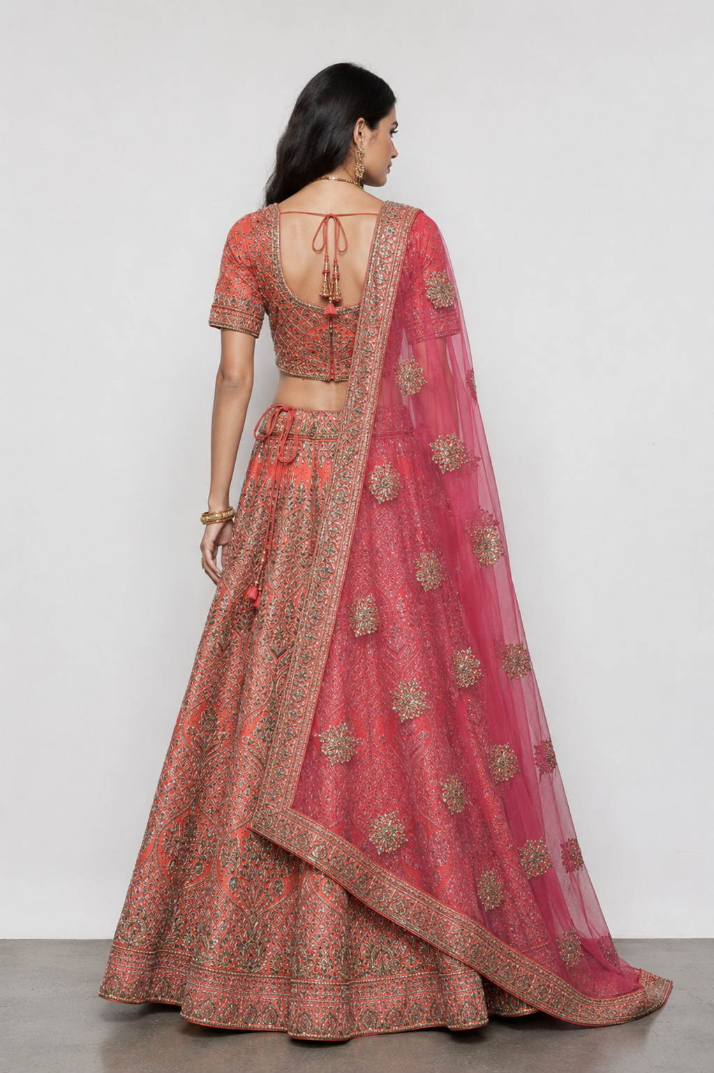 Orange Raw Silk Bridal Lehenga with Kardana Kashab Moti work